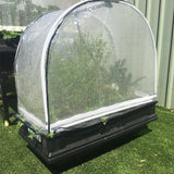 Protective cover on raised garden bed